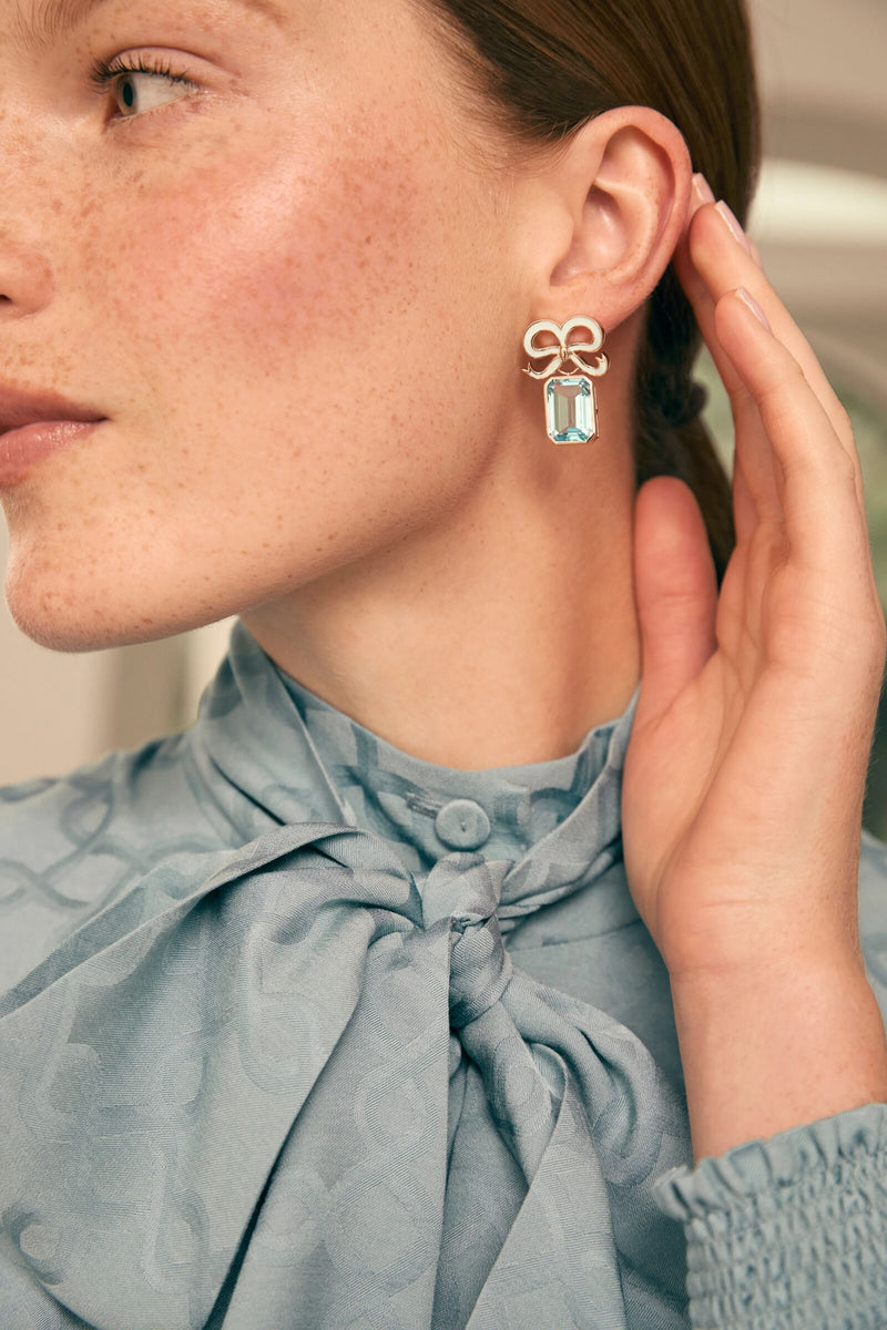 Load image into Gallery viewer, Solid Gold and Topaz Bow Earrings Sky Blue x Philippa Herbert