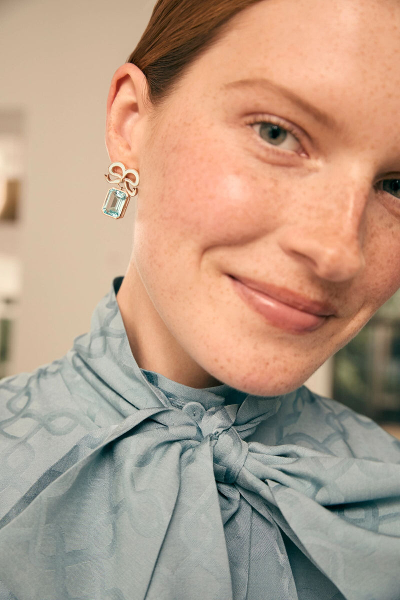 Load image into Gallery viewer, Solid Gold and Topaz Bow Earrings Sky Blue x Philippa Herbert