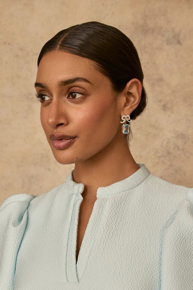 Load image into Gallery viewer, Solid Gold and Topaz Bow Earrings Sky Blue x Philippa Herbert